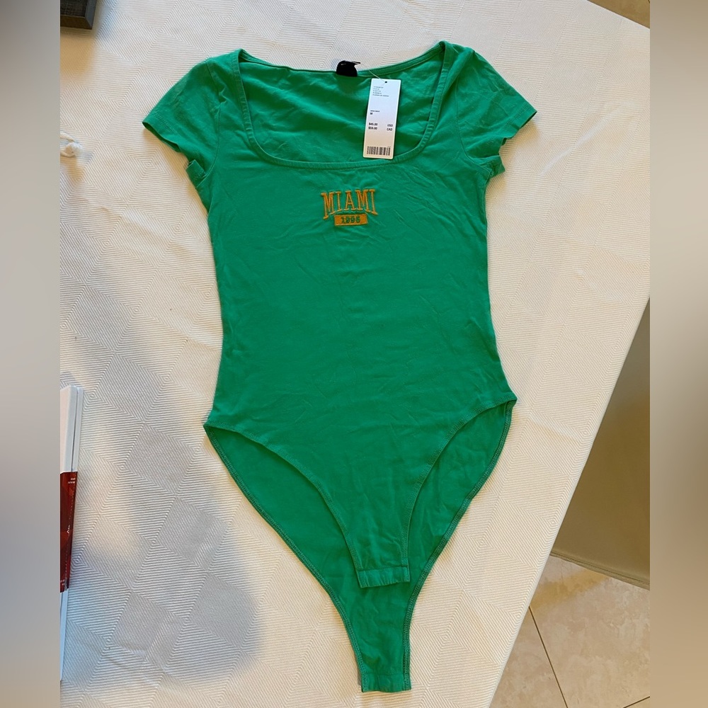 green bodysuit
